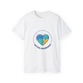 White t-shirt with a heart-shaped puzzle piece design and 'Autism Awareness' text on a white background