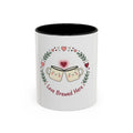 White mug with black interior, featuring cartoon mugs and hearts with 'Love Brewed Here' text on a white background.